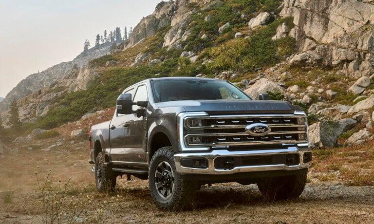 Two 2024 Ford Super Dutys parked in the mountains