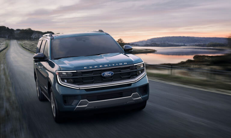 2025 Ford Expedition driving on lakeside road
