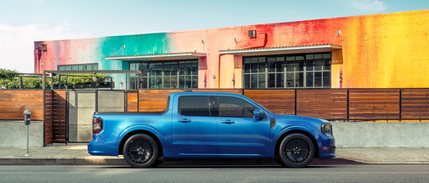 2025 Ford Maverick parked by a rainbow wall