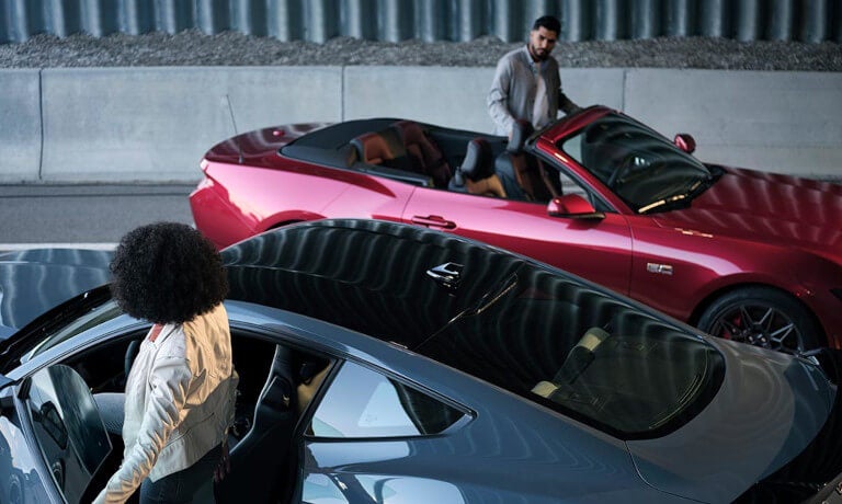 2025 Ford Mustang pair driving opposite directions