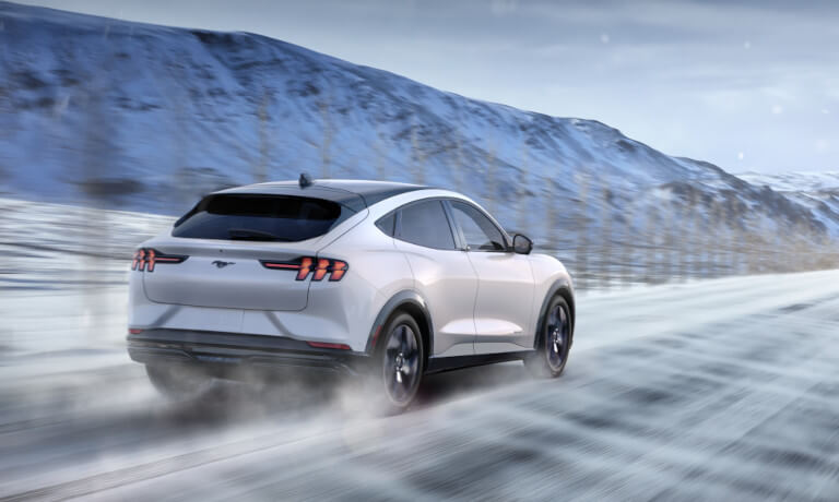 2025 Ford Mustang Mach-E driving in the snow