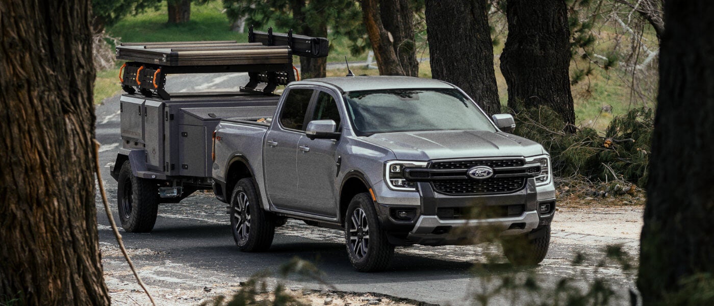 2025 Ford Ranger towing a trailer in a forest