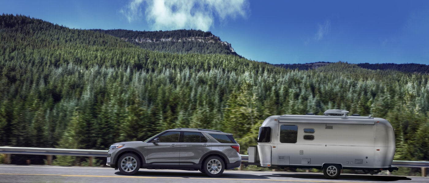 2026 Ford Explorer side view pulling camper