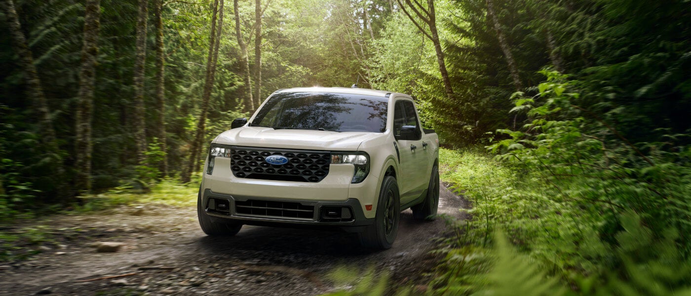 2026 Ford Maverick driving in a forest