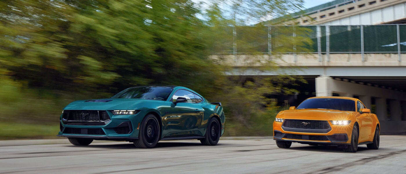 2026 Ford Mustang pair on a city road