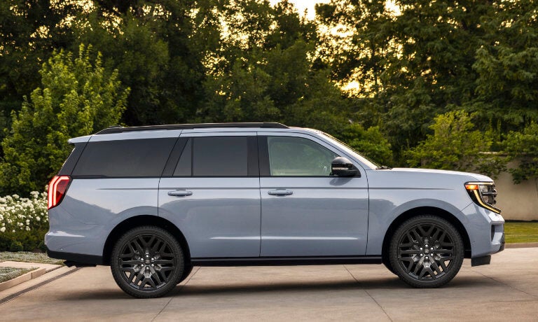 2027 Ford Expedition side view with trees