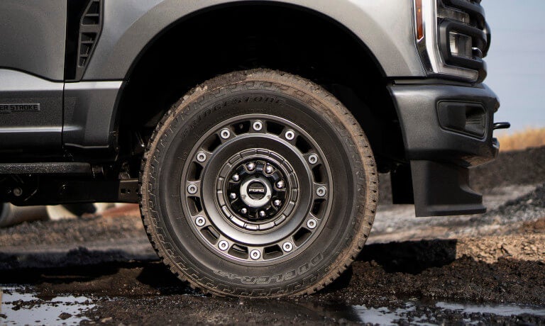 2027 Ford Super Duty front wheel detail in mud